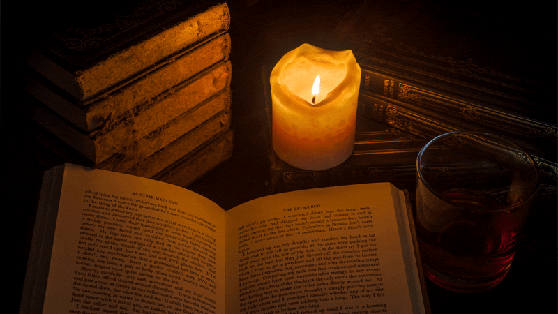 Cinemagraph of Candle and Books